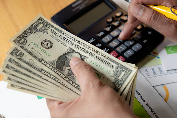 Organized financial savings currency and notes on table